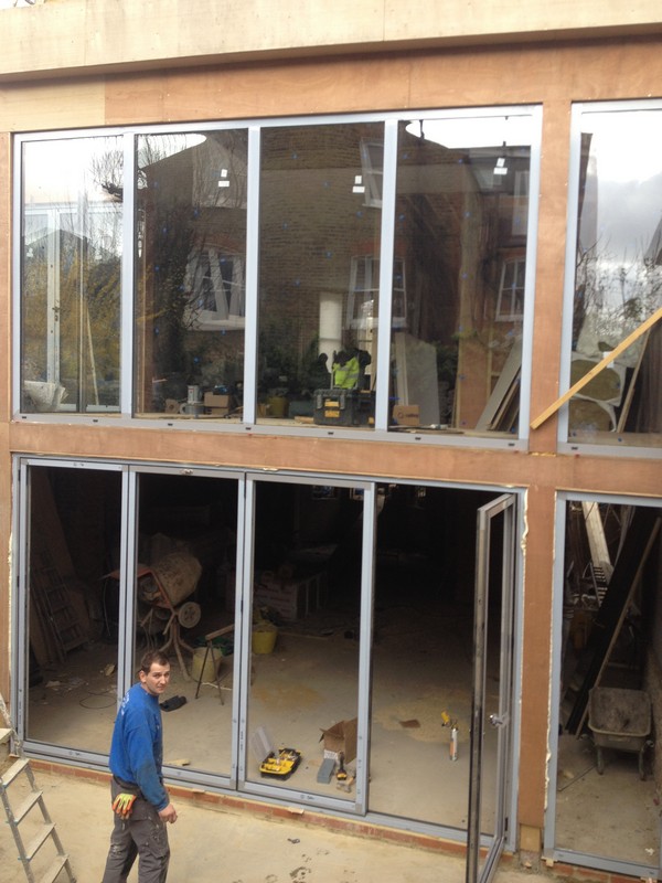 Aluminium bi-fold doors with two-storey glazing in Enfield