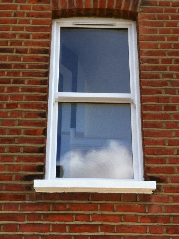 uPVC sash window on Victorian red brick house in Enfield